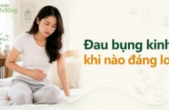 Phụ nữ ôm bụng dưới vì đau bụng kinh, bên cạnh headline “Đau bụng kinh: khi nào đáng lo?”.
