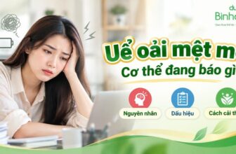 Người phụ nữ uể oải, mệt mỏi trước bàn làm việc. Bên cạnh là nguyên nhân, dấu hiệu và cách cải thiện.